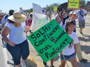 Solidarity activists march outside Corcoran prison to support thousands of prisoners on hunger strike