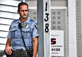 Minneapolis police officer outside a home