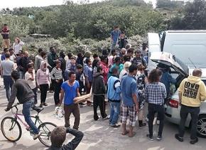 Activists with London2Calais distribute food in the refugee camp in France