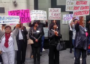 Midtown residents and their supporters gather for a rent control rally